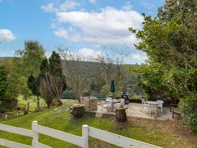 An outdoor area with seating and a grill at Family Country Cottage with a private Valley View