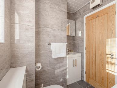 A bathroom with a sink and toilet at Luxury 2 Bed Room Lake View Apt Bowness Parking in Bowness-On-Windermere