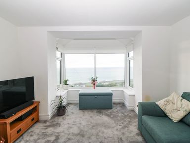 A living room with a view of the sea at Briar Bank in Barmouth