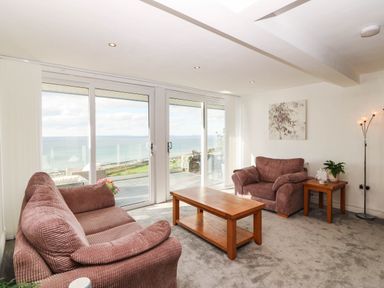 A living room with sofas and a coffee table at Briar Bank in Barmouth