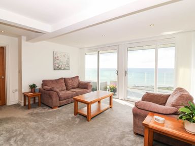 A living room with sofas and a coffee table at Briar Bank in Barmouth