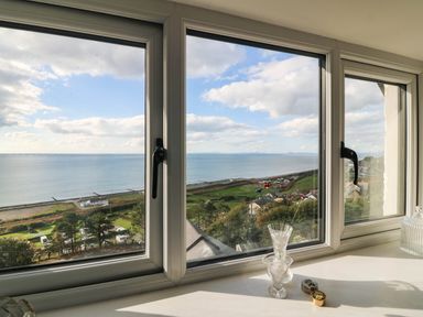A view from a window overlooking the sea at Briar Bank in Barmouth