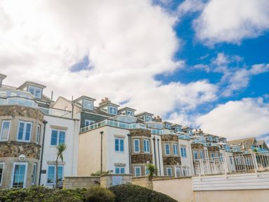 A row of houses with balconies at 21 Compass Point in Carbis Bay