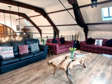 A living room with seating and a wooden coffee table at Kaber Chapel in Kaber near Kirby Stephen