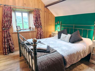 A bedroom with a bed and window at Kaber Chapel in Kaber near Kirby Stephen