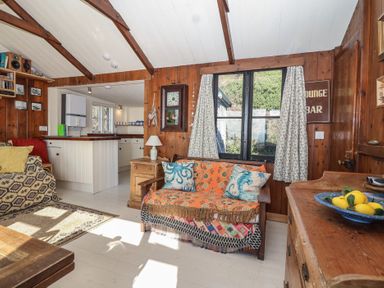 A living room with a sofa and table at The Cabin in 