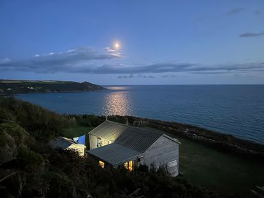 A house by the ocean with a view of the moon at The Cabin 