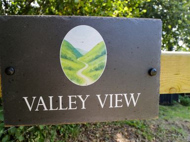 A sign displaying the name Valley View at Valley View Shepherd's Hut in South Molton