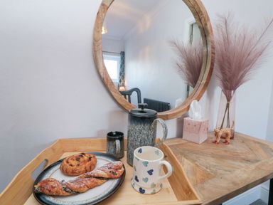 A tray with pastries and a mug on a table at Cuckoo's Nest in Whitby