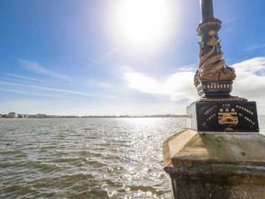 A lamp post beside water with buildings in the background at Flat 17 Golden Gates in Poole