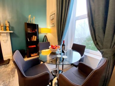A dining room with a table and chairs at 2A Redcliffe Torquay