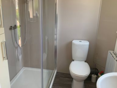 A bathroom with shower and toilet at Amber House in Dorchester