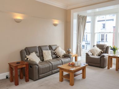 A living room with a sofa and armchairs at Time Out in Whitby