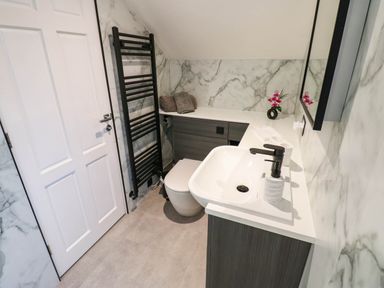 A bathroom with a sink and toilet at Stone Lodge near Haltwhistle