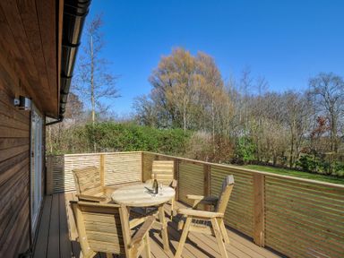 A deck with a table and chairs at 4 Southern Place in Dobwalls