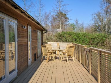 A deck area with a table and chairs at 4 Southern Place in Dobwalls