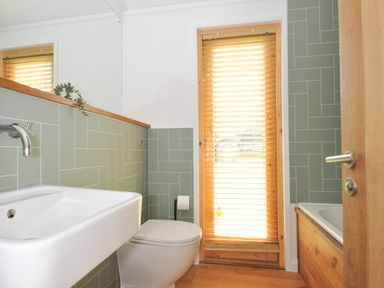 A bathroom with a sink and toilet at 4 Southern Place in Dobwalls