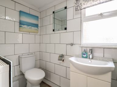 A bathroom with a toilet and sink at 130 Park Ave Holiday Village