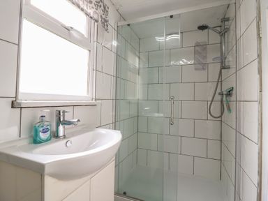 A bathroom with a sink and shower at 130 Park Ave Holiday Village