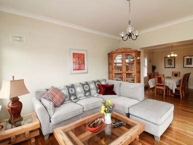 A living room with a sofa and coffee table at Sunnyside in River Chapel