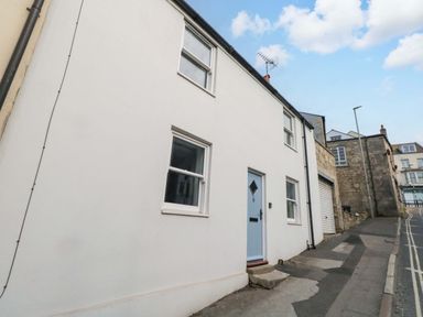 A house with windows and a door on the street at NO 10 in Fortuneswell