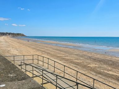 A beach view with a pathway and sea in Leysdown-On-Sea, Kent at Watersmeet - 85 @ Park Avenue Holiday Village