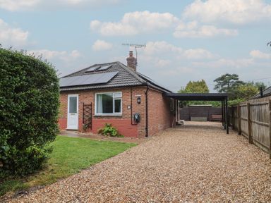 A house with a garden and pathway at 2 North Road in Maiden Newton, Dorset