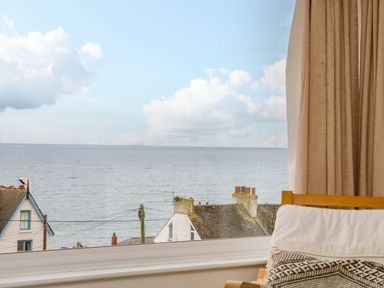 A view from a living room window overlooking the ocean at Wootton Gray in Penzance