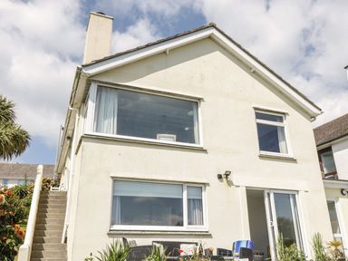 A house with large windows and stairs at Wootton Gray in Penzance