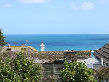 A view of the sea and rooftops at Wootton Gray in Penzance