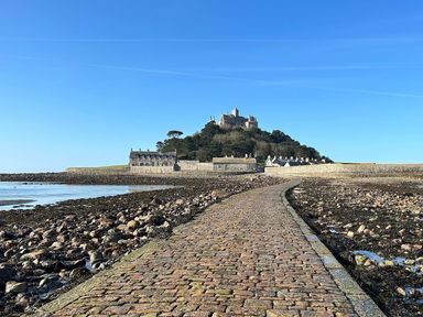 A pathway leading to a castle on a hill at Dog-friendly lodge, steps to St Ives train, Hayle