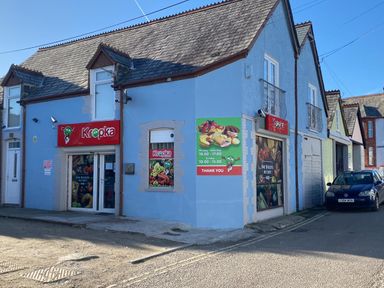 A storefront with signage and windows at Kropka in 