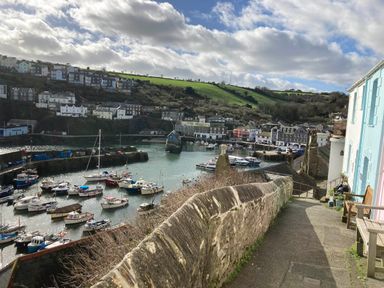 A view of a harbor with boats and houses at tbc 