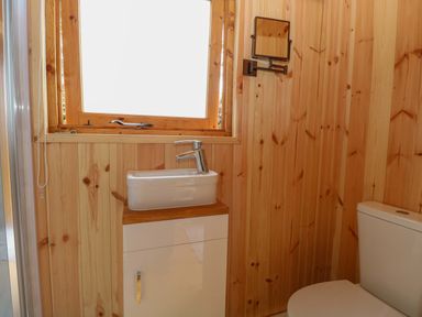 A bathroom with a sink and toilet at Hazel