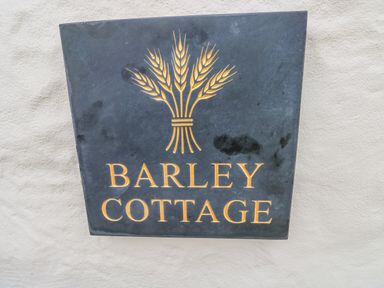 A sign displaying the name Barley Cottage