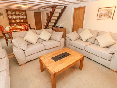 A living room with sofas and a coffee table at Maerdy Lodge