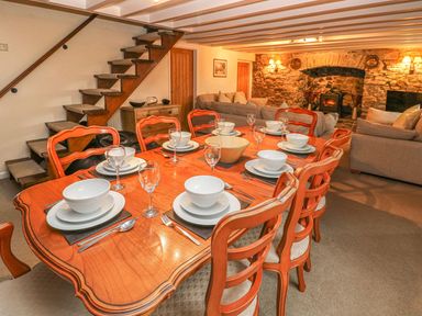 A dining room with a table set for meals at Maerdy Lodge 