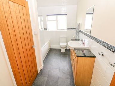 A bathroom with a sink and toilet at Maerdy Lodge