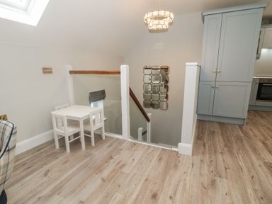 A landing with a table and chairs at 2 Ard an Chuain Dunfanaghy