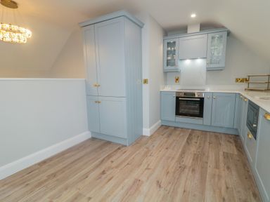 A kitchen with cabinets and an oven at 2 Ard an Chuain Dunfanaghy
