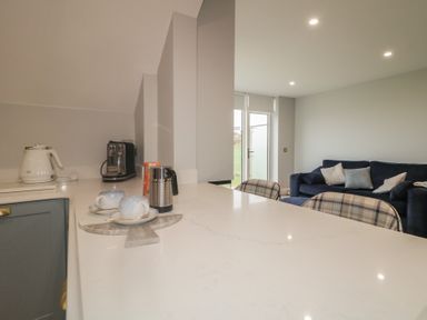 A kitchen with a kettle and coffee maker at 2 Ard an Chuain Dunfanaghy