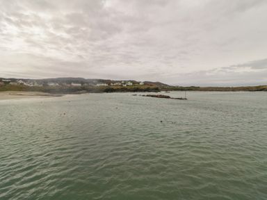 A coastal view with water and houses in the background at 2 Ard an Chuain, Dunfanaghy