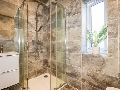 A bathroom with a shower and sink at Meadow Retreat Bodmin