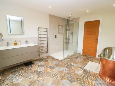 A bathroom with a shower and a sink at Hazeldene near Harvington