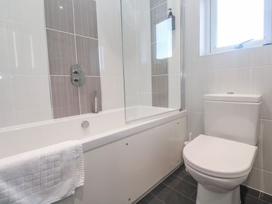A bathroom with a bathtub and shower at Warleggan Redruth