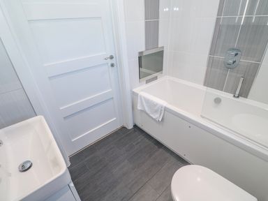 A bathroom with a sink bathtub and toilet at Warleggan Redruth