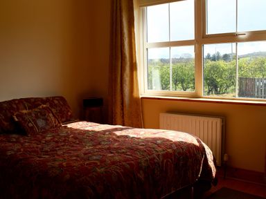 A bedroom with a bed and window at Welcome to the wild Atlantic way, Mulroy Bay