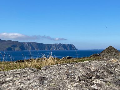 A coastal view with grass and rocks at Welcome to the wild Atlantic way Mulroy Bay