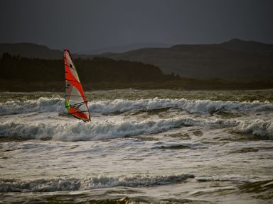 A windsurfing board on ocean waves at Welcome to the wild Atlantic way Mulroy Bay