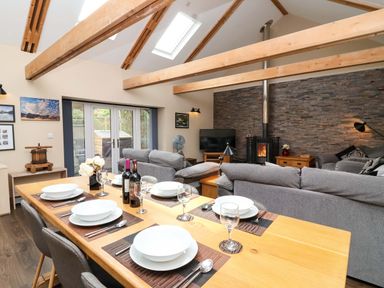 A dining area and living room in Cider Press Cottage Torpoint